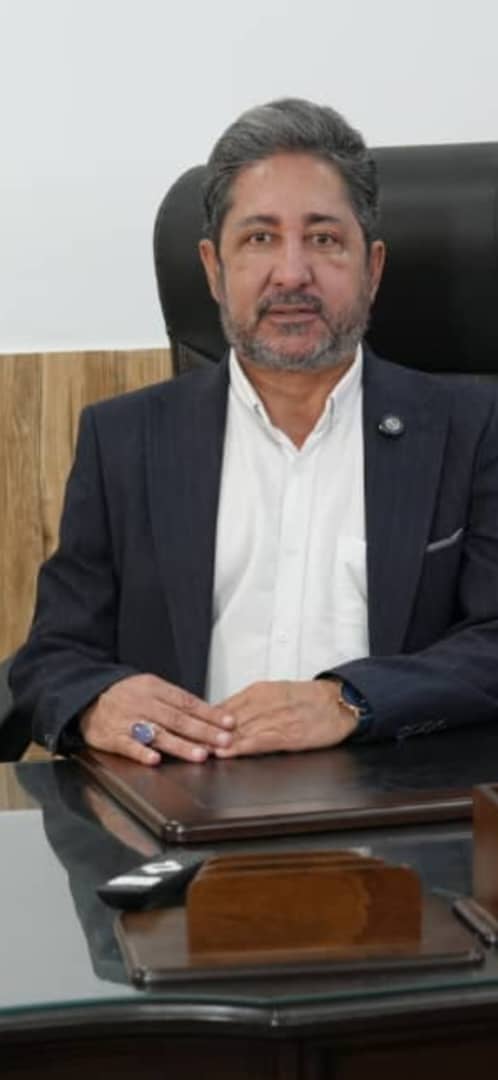 Dr Kamarzarin in his office